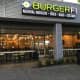 The decor at the newly opened BurgerFi in Poughkeepsie is made from recycled materials and its burgers are made with beef from the company's own grass-fed cattle.