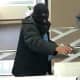 Police in Nassau County released a photo of an armed robber who took a gun into a Bank of America location in Great Neck.