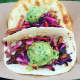 Candied Apple Roast Pork Tacos with Guac are a favorite at the many street fairs they attend.