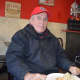 A Jolly Nick's customer enjoys his usual hot dog with sour kraut.