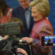 An array of cameras surround Hillary Clinton as she makes a stop at her polling place in Chappaqua to vote in the Democratic presidential primary.