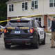 A Norwalk police cruiser arrives at the scene of a stabbing at a housing complex in Norwalk Wednesday morning.