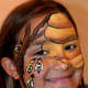 Larissa paints bees and beehives on faces, and also works as a beekeeper for a living.