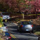 Police investigate the area of Norfield Road where human remains were found Thursday