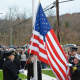 A flag-raising ceremony is held at the new Croton Falls firehouse.