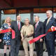 Charlie Osso cuts the ribbon in front of the Rudy's new location, in the renovated Closter Plaza.