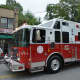 A Mount Kisco firetruck is driven in the fire department's annual parade. The truck is for the Rescue Fire Police, which is one of four fire companies that makes up the department.
