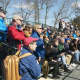 Fans watch the action Sunday in Darien.