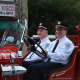 Former Chappaqua Fire Chief Russell Maitland drives an antique firetruck in the Mount Kisco Fire Department's annual parade.