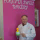 Sky Mercede of Forever Sweet Bakery in Norwalk poses in his store Monday.