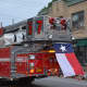 A Texas state flag is flown from a Bedford Hills firetruck. Bedford Hills firefighters paid tribute to slain Dallas police who were killed in a shooting.