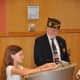 Cadet Scout, Morgan Mohr from Troop 50167 reads Lincoln's Gettyburg Address at the Memorial Day Ceremony
