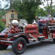 An antique firetruck from Westerly, R.I. is driven in the Mount Kisco Fire Department's annual parade.
