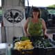 Stacia Monahan from Stone Gardens Farm in Shelton sets up shop at the Shelton Farmers Market.