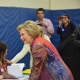 Hillary Clinton checks in to her polling place at Chappaqua's Douglas G. Grafflin Elementary school in order to vote in New York's Democratic presidential primary.