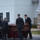 Pallbearers move Frances Ghelarducci's casket into a hearse following her funeral at St. Joseph's Church in Somers.