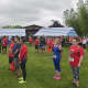 Runners/walkers listen to the National Anthem prior to Sunday's 5K.