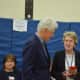 Hillary and Bill Clinton chat with Chappaqua Schools Superintendent Lyn McKay. The Clintons came to Douglas G. Grafflin Elementary School on Tuesday to cast their votes for New York's Democratic presidential primary.