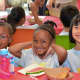 Children enjoy themselves at the annual OPUS Campership Picnic at the Community Center of St. Luke’s parish in Darien.