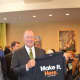 Sikorsky President Dan Schultz holds up the new T-shirt he received Monday at Housatonic Community College.