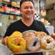 Marc Windler of Bakin' Bagels with a tray of fresh-baked bagels.