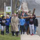 A crowd of about 40 carried the cross from the First Congregation Church to St. Luke's on Good Friday.
