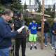 A crowd of about 40 carried the cross from the First Congregation Church to St. Luke's on Good Friday.