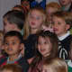 Kids singing during the "Thanksgiving Sing" at Methodist Family Center Preschool in Darien.