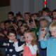 Kids doing the chicken dance at the "Thanksgiving Sing."