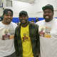 From left: Michael Little-Redd, Silas Redd and Carver Teen Center manager Tremain Gilmore at Saturday's clothing drive.