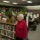 A library worker welcomes visitors at Sunday's reception.