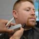 Hillsdale Police Officer Alex Kaplan loses his beard at the Shave Off.