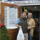 Happy customers leave Rowayton Seafood on Christmas Eve with fixings for a feast.
