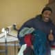 A grateful man finds clothing items at the mission's giveaway.