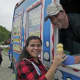 Owner Michael Fertucci serves up ice cream cones at a recent birthday party.