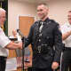 Hillsdale Police Chief congratulates new Patrolman Corey Rooney.