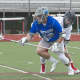 Bronxville's Andrew Babyak wins possession as Somers player pursues.