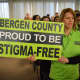 Michele Hart-Loughlin of Old Tappan stands in support of Bergen County Executive Jim Tedesco's impassioned defense to retain state funding for mental health services.