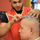 Stylist Vlady Garcia of New Milford works on a client at Cache Latino in Bergenfield. Garcia hails from Santo Domingo.