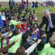 Mayor Harry Rilling greets school kids at Friday's ceremony.