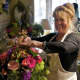 Annabel Green Flowers owner Wendy Manes prepares arrangements for Mother's Day in her Wilton shop.