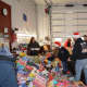 Sorting through mountains of toys at the Closter firehouse.