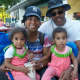 A family enjoys 4-H milkshakes on opening day at the fair.