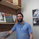 Hudson Valley Vinyl owner Chris Reisman gets his store ready for opening day.