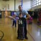 Amazing Grace Circus Creative Director Carlo Pellegrini, also known as “Mr. Amazing,” helped a second-grader with diabolo manipulation.