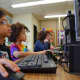 Students at the Dows Lane Elementary School in Irvington use their imaginations and what they learned in computer class to blast through coding exercises.