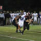 Hasbrouck Heights running back Nico Facchini takes the hand off from quarterback Frank Quatrone late in the game.