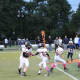 Pee Wee Aviator quarterback Ethan Perez hands off to running back Nicholas Grasso early in the game against Rutherford.