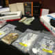 The arsenal of weapons, cash, and drugs seized by Nassau County Police in Farmingdale