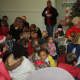 Former Supervisor Penny Hickman read the "The Night Before Christmas" to children attending the event.